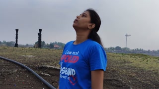 Woman smoking nearby lake