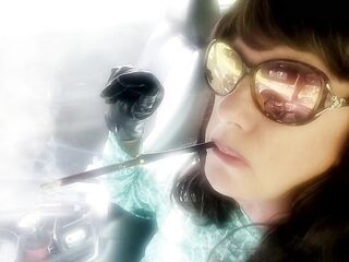 OLDER BRUNETTE HAIR MRS. ROMAN CAR SMOKIN' HER GREATER QUANTITY 120 MENTHOLS IN HER EBONY CIGARETTE HOLDER