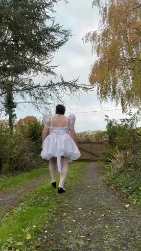 Dressed in a short wedding dress to play the maid for a day