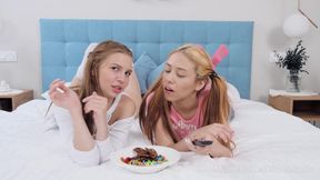 Two playful teens lick and finger each other's pussies on the bed