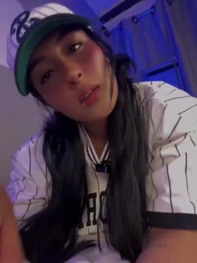 Woman in baseball cap and jersey