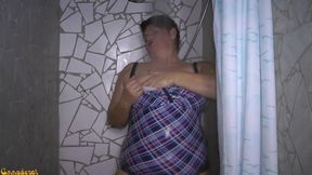 In swimsuit under the shower