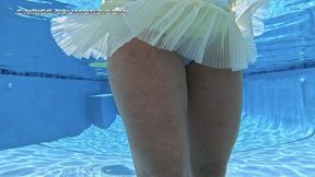 Carissa in the yellow vintage slip, white panties, and tiny tank top swimming strip tease