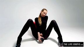 Young cutie in a catsuit fucks herself the ass with bottle