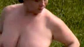 ”A sexy fatty masturbates outdoors”