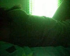 Busty girlfriend masturbates in bed on night vision cam