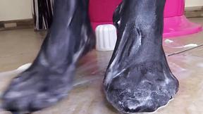 ”Brunette in pantyhose gives footjob to a cream tube”