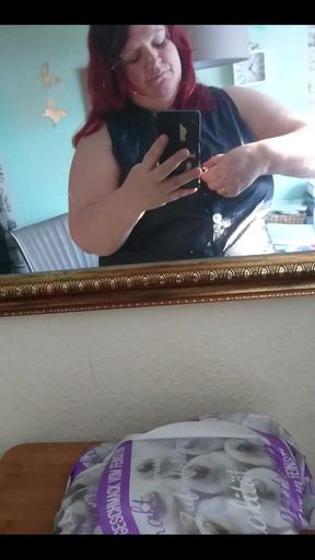 Showing off in a cool lab coat in front of the mirror