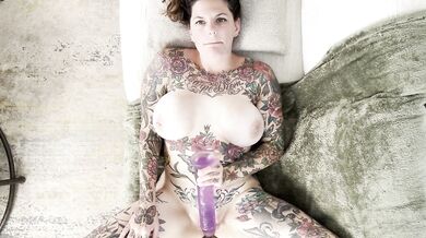 Tattooed milf with huge tits fucks herself raw and gushes everywhere