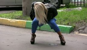 Blonde girl in Russia squats and pisses in her pants
