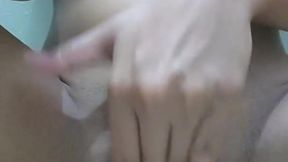 Asian girl in FTM attire masturbates while pissing