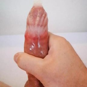 Boy masturbating his dick until cumshot in condom