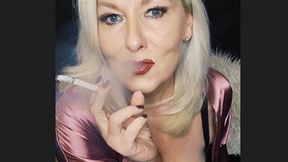 Smoker MILF wrapped in beautiful pink satin sucks her cork powerfully