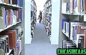 Busty brunette sexy girl in library usa