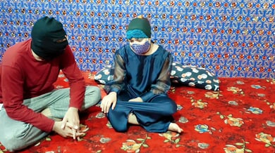 Masked South Asian couple shares intimate kiss and titjob on floral rug
