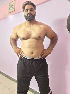 Muscular Indian Man Jerking While Standing