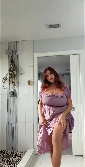 Sensual woman tries on sexy lingerie, flaunting big natural tits