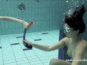 Girls swimming underwater and enjoying eachother