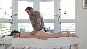 Masseur explores oily body of a brunette teen, including her pussy