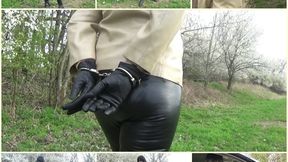 Handcuffed wife in leather leggings and jacket