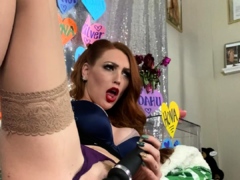 Beautiful redhead uses toy to masturbate