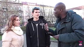 Exploring the city, they stumble upon a black man with a massive pole