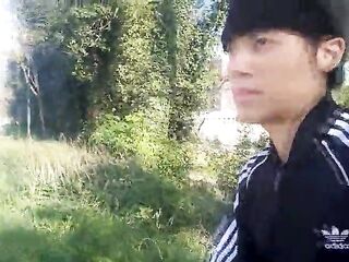 Freeballing in public, this twink walks outdoors commando, no underclothes underneath his ebony Adidas tracksuit, Campus sneakers, during the time that out cruising