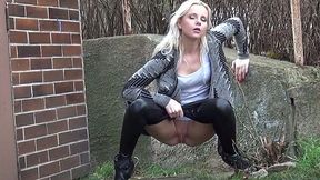 Wanton blond haired cutie adores pissing near garage