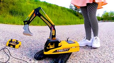 Big excavator is destroyed kicked, trampled, crushed, smashed, crushed, broken plastic car, crush