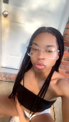 Trans girl applies lipstick in a lip-related fetish clip