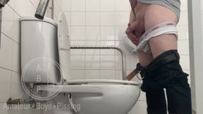 In the Hospital Toilets, a Guy Pisses Into a Cup for a Urine Sample, Then Gets Horny, Jerks-off and Cums
