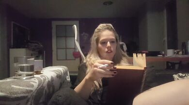 Blonde Czech chick teases while smoking and flipping pages