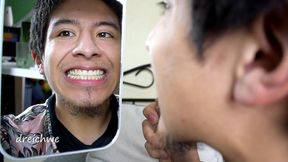 checking my teeth in the mirror