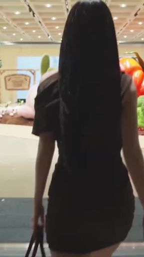 Hot Asian babe shows off her pretty legs and sexy body