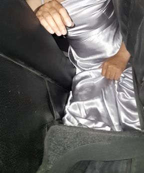 Masturbating wearing satin silver long dress in car