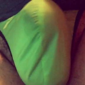 Playing with my bulge in a green silkey man thong