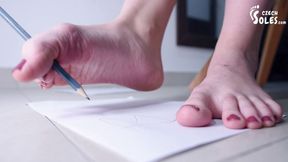 Teen foot model writing and drawing with her bare feet