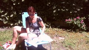 italian girl sunbathing in a public garden with a big dirty diaper