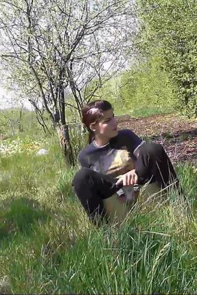 Pissing in grass on the side of the road