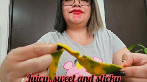 Itzia loves the mango, she listens to it getting dirty, enjoys it and sucks on it