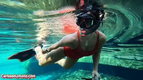 Carissa in the spring wearing a red one-piece vintage bathing suit