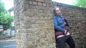 Ashley Riders, the daring British babe, flashes her sexy rack in a public park