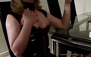 Shemale in latex smokes & strokes