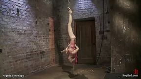 Blond lesbian slave Amber Rayne gets bound and punished by lezdom Claire Adams.