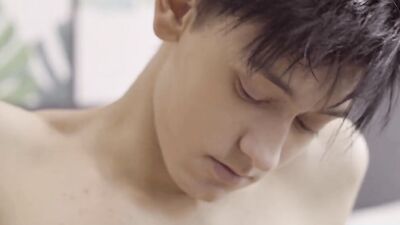 Beautiful twink strokes his huge cock and rubs his ass