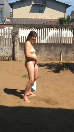 My wife drop the towel outside and pissing naked   Clip 1