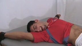 Ticklish and sexy soccer player is bound on the table