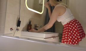 Cute college girl in a polkadot mini skirt reveals her lace panties and curves.
