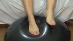 Filling a 42-inch balloon to squeeze it with my feet
