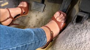 Brown high heels driving